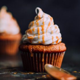 Pumpkin Cupcakes with Marshmallow Frosting and Caramel. This decadent fall cupcakes are lightly spiced and make a wonderful portable fall dessert.