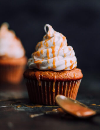 Pumpkin Cupcakes with Marshmallow Frosting and Caramel. This decadent fall cupcakes are lightly spiced and make a wonderful portable fall dessert.