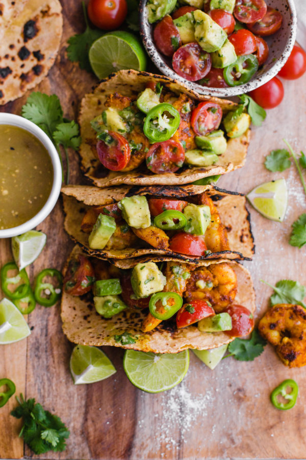 Mumbai Shrimp Tacos with Avocado Salsa - this EASY shrimp taco recipe is packed with spice and topped with a simple avocado tomato salsa!