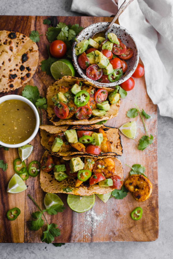 Mumbai Shrimp Tacos with Avocado Salsa - this EASY shrimp taco recipe is packed with spice and topped with a simple avocado tomato salsa! 