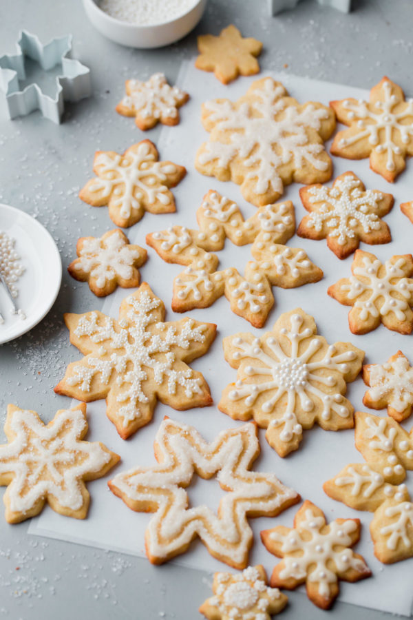 Almond Sugar Cookies - delicious crisp, tender, and buttery sugar cookies made with almond meal and flavored with almond extract and fresh orange zest. Topped with a simple cookie icing!