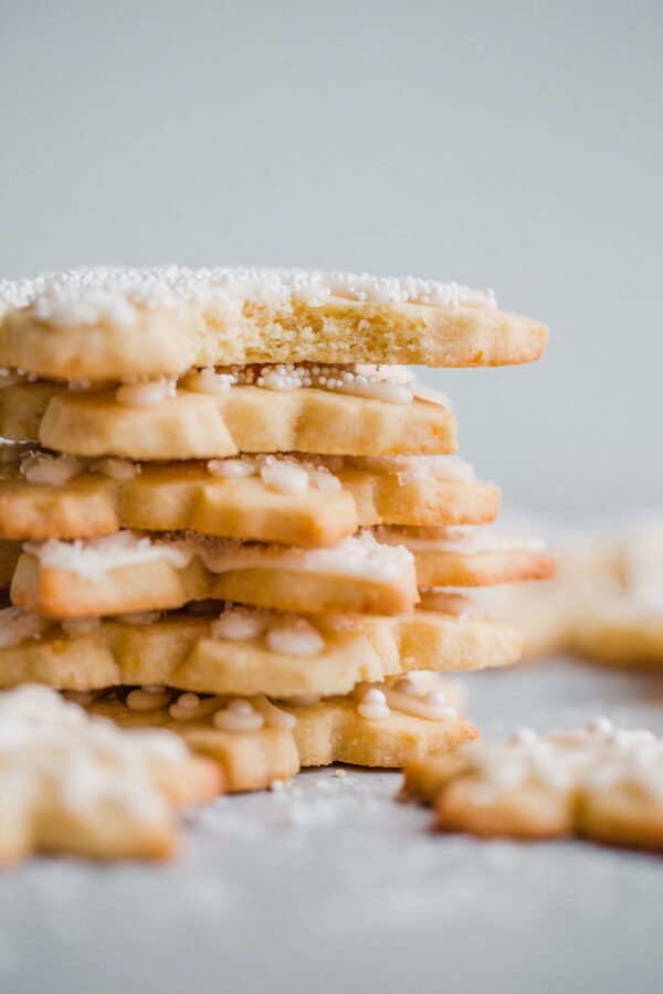 Almond Sugar Cookies - delicious crisp, tender, and buttery sugar cookies made with almond meal and flavored with almond extract and fresh orange zest. Topped with a simple cookie icing!