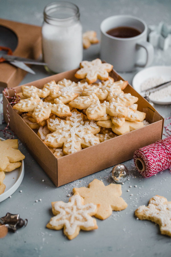 Almond Sugar Cookies - delicious crisp, tender, and buttery sugar cookies made with almond meal and flavored with almond extract and fresh orange zest. Topped with a simple cookie icing!