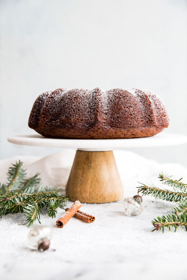 Gingerbread Bundt Cake - this easy, perfectly spiced bundt cake is served with an eggnog whipped cream. A festive cake recipe for the holiday season!