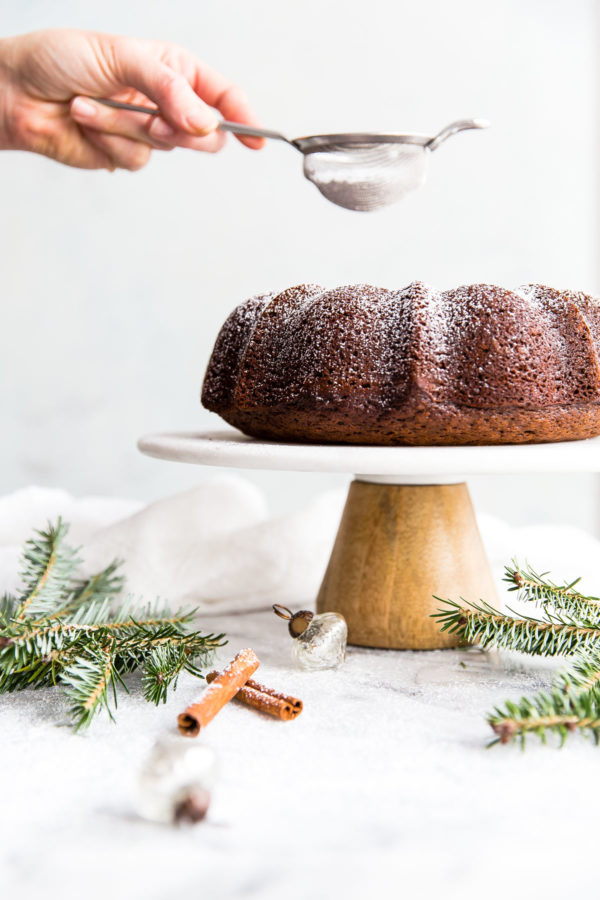 Gingerbread Bundt Cake - this easy, perfectly spiced bundt cake is served with an eggnog whipped cream. A festive cake recipe for the holiday season!