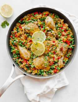 Arroz Con Pollo - an easy, comforting ONE pot meal that comes together in less than 45 minutes. This classic Spanish and Mexican dish is made with rice, chicken, bell peppers, and spices.