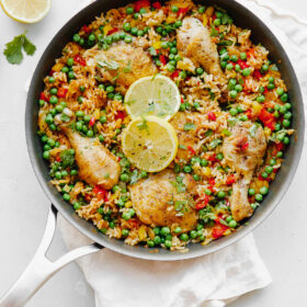 Arroz Con Pollo - an easy, comforting ONE pot meal that comes together in less than 45 minutes. This classic Spanish and Mexican dish is made with rice, chicken, bell peppers, and spices.