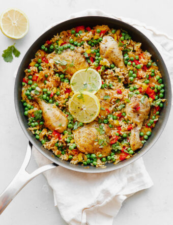 Arroz Con Pollo - an easy, comforting ONE pot meal that comes together in less than 45 minutes. This classic Spanish and Mexican dish is made with rice, chicken, bell peppers, and spices.