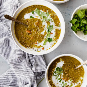 Slow Cooker Curried Lentil Soup - an EASY flavorful lentil soup flavored with turmeric, ginger, cardamom, cloves, cinnamon, and coconut milk.