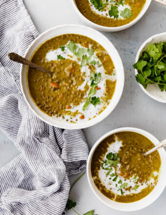 Slow Cooker Curried Lentil Soup - an EASY flavorful lentil soup flavored with turmeric, ginger, cardamom, cloves, cinnamon, and coconut milk.