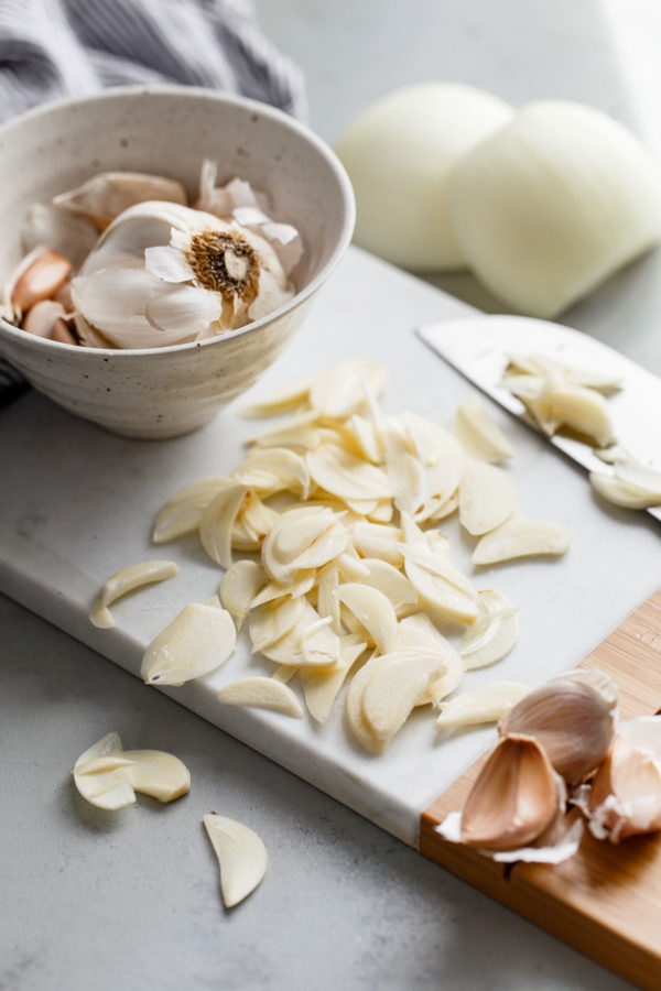 sliced garlic on cutting board