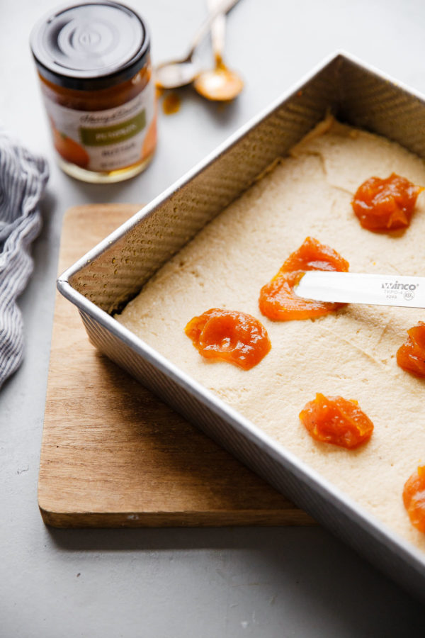 Offset Spatula Spreading Pumpkin Butter Layer in Coffee Cake Batter