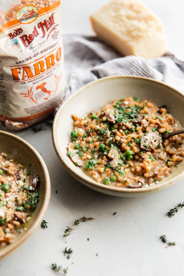 Farro Risotto with Mushrooms and Peas with Bob's Red Mill Farro Bag in Background