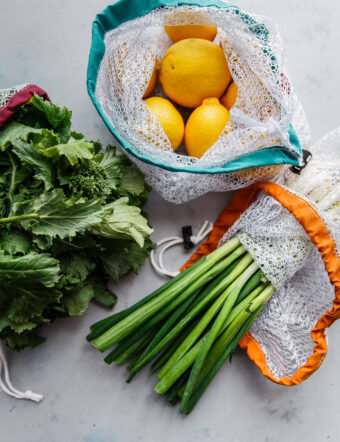 fresh fruit and vegetables in reusable produce bags