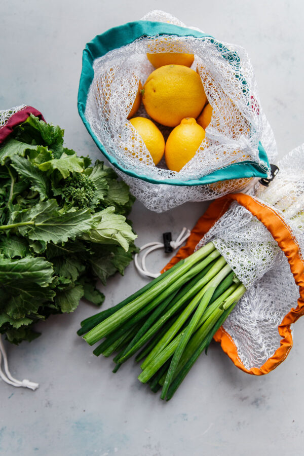 fresh fruit and vegetables in reusable produce bags