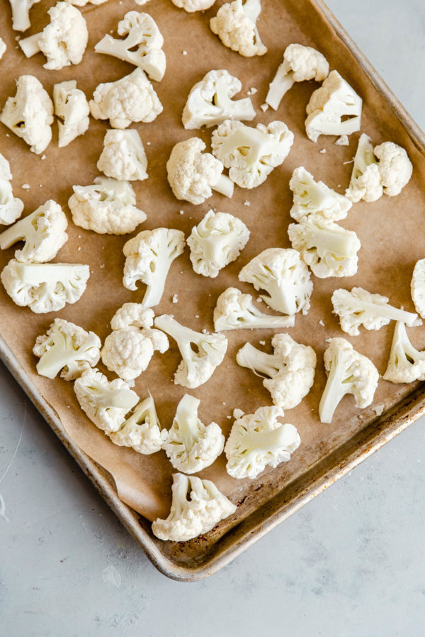 Cauliflower Florets on Parchment Lined Half Sheet Pan