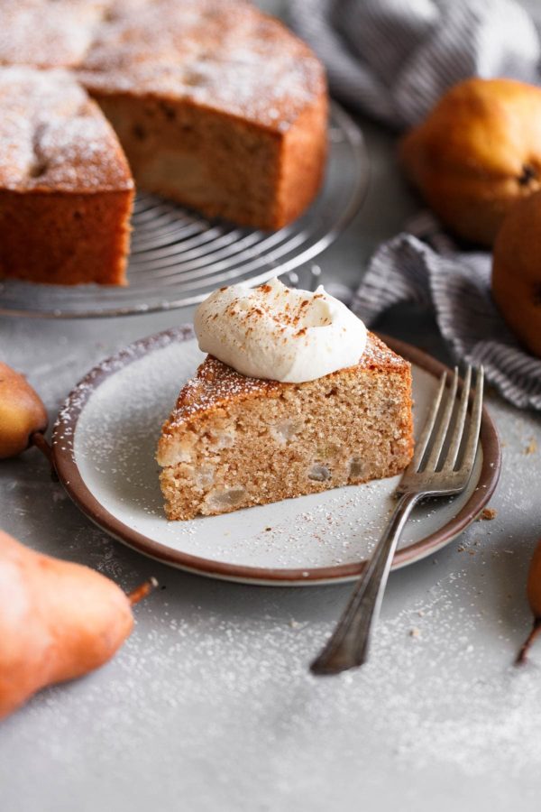 Spiced Almond Pear Cake topped with lightly sweetened whipped cream