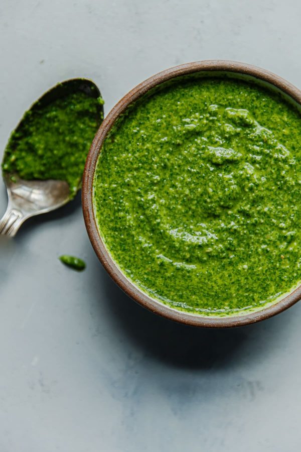 Homemade Arugula Pesto in Bowl with Spoon