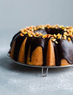 Orange Bundt Cake with Chocolate Glaze topped with Candied Orange Pieces