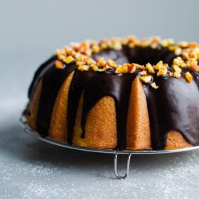 Orange Bundt Cake with Chocolate Glaze topped with Candied Orange Pieces