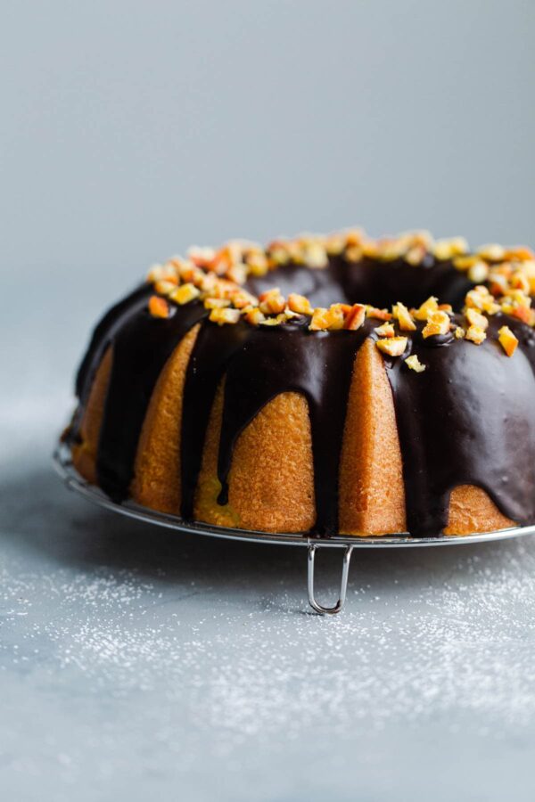 Orange Bundt Cake with Chocolate Glaze topped with Candied Orange Pieces 