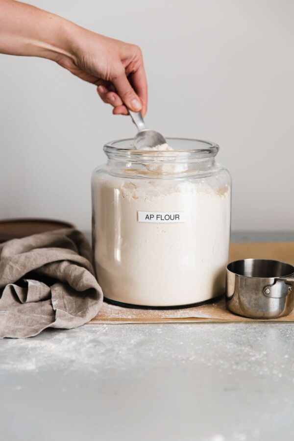 Person Measuring Flour