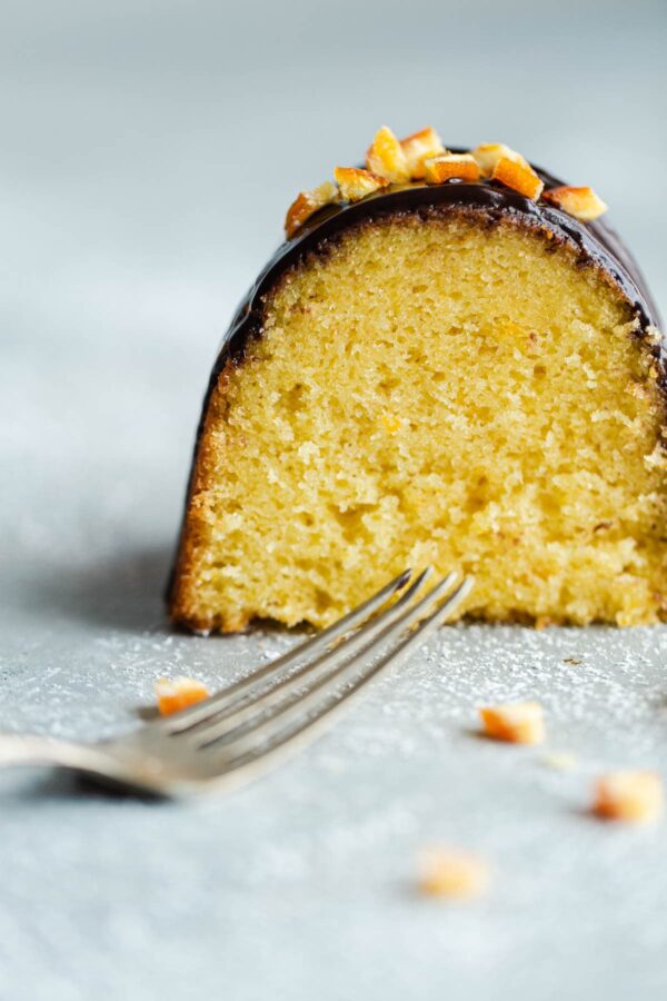 Fork in front of Slice of Orange Bundt Cake