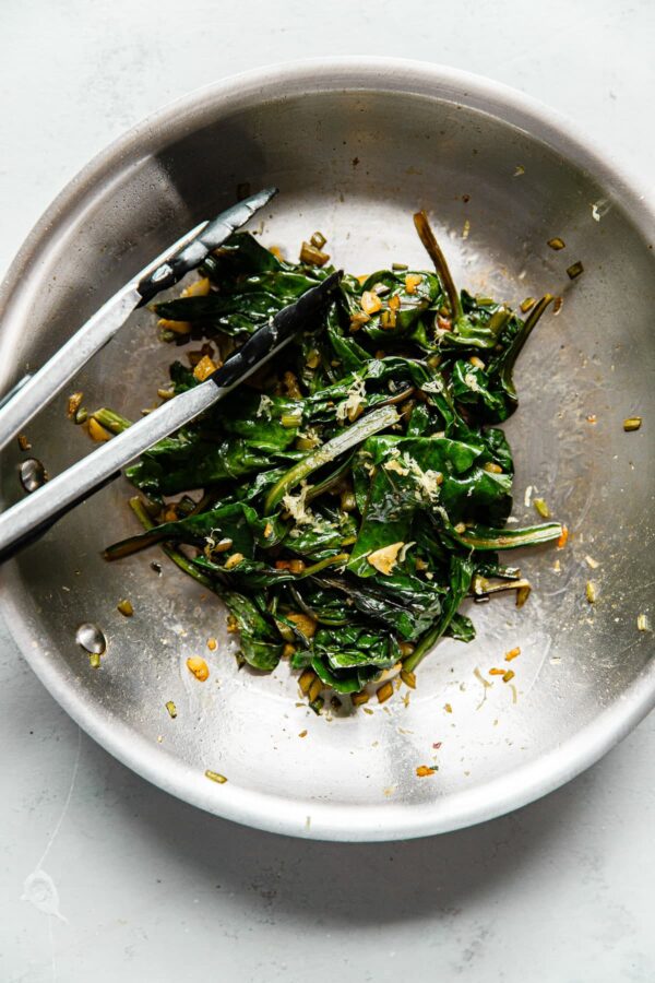 Sautéed Beet Greens in Skillet with Tongs