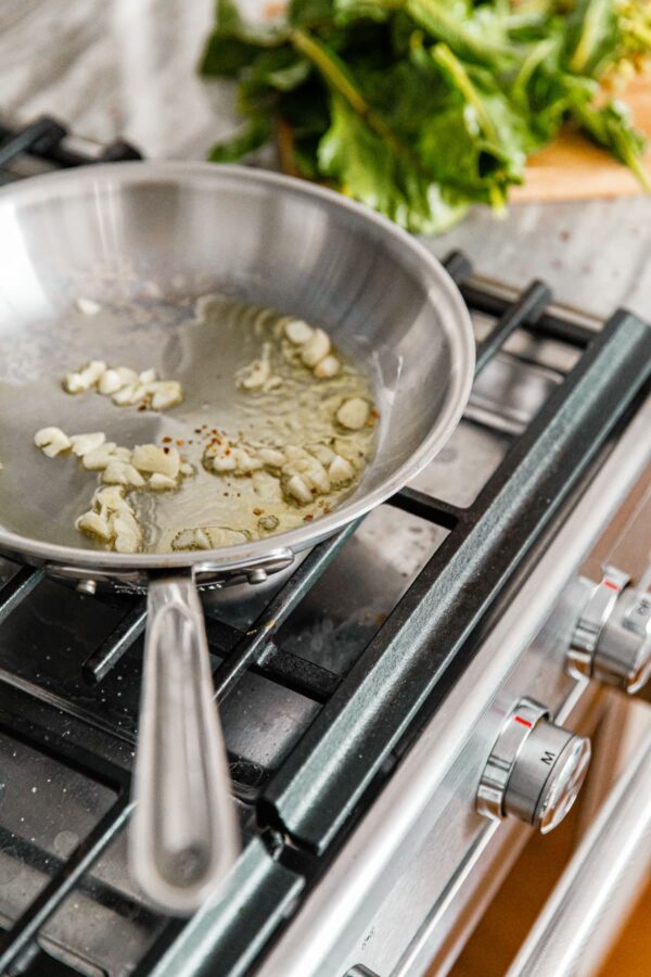 Sautéed Garlic in Pan on Stove