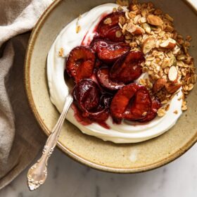 Roasted Plum Compote with Yogurt in Ceramic Bowl