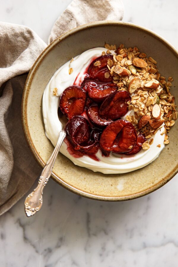 Roasted Plum Compote with Yogurt in Ceramic Bowl