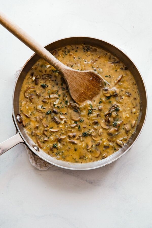 Vegetarian Mushroom Gravy in Skillet with Wooden Spoon