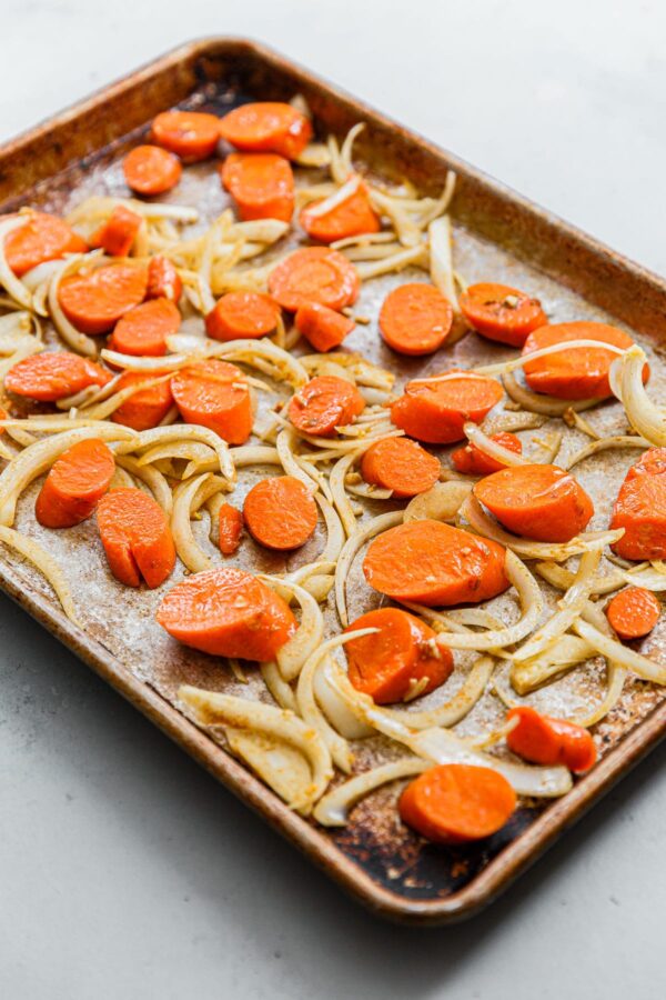 Sliced Carrots and Onions on Half Sheet Pan