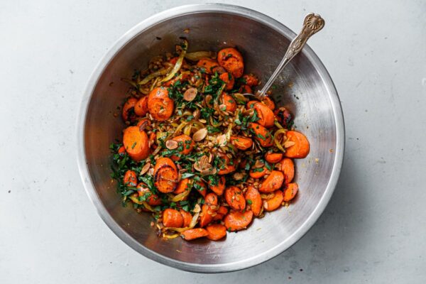 Roasted Carrots, Herbs, and Sliced Almonds in Stainless Steel Bowl