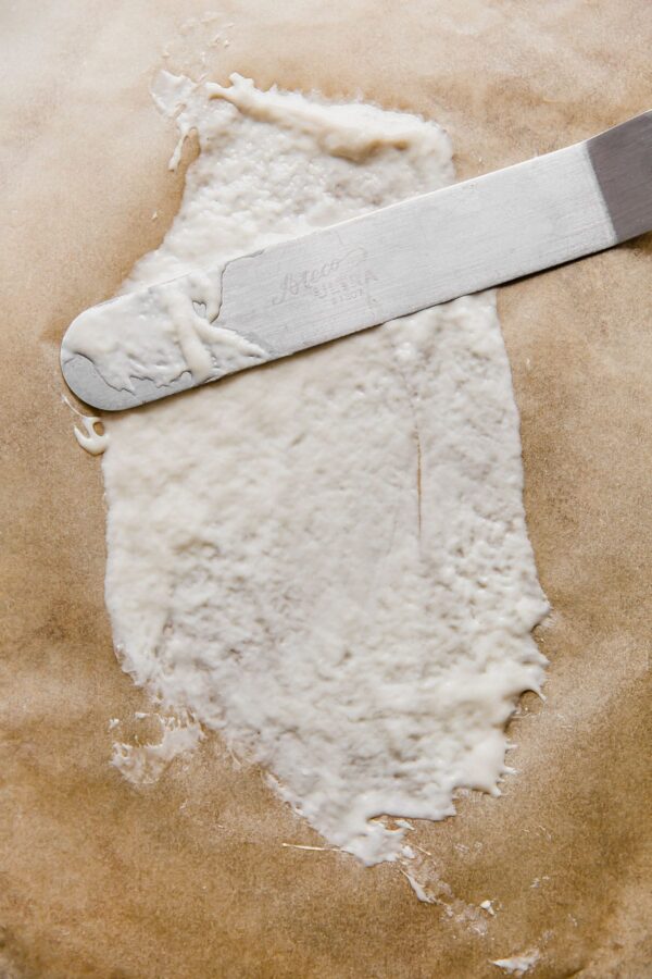 spreading sourdough starter with offset spatula for drying