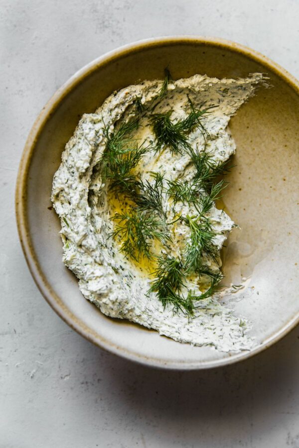 Garlicky Herbed Goat Cheese Spread in Ceramic Bowl