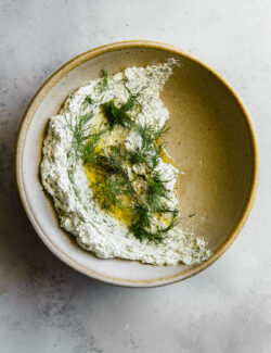 Garlicky Herbed Goat Cheese Spread in Ceramic Bowl