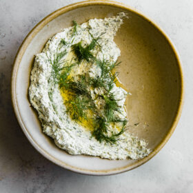 Garlicky Herbed Goat Cheese Spread in Ceramic Bowl