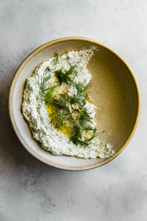 Garlicky Herbed Goat Cheese Spread in Ceramic Bowl