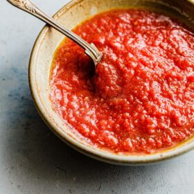 Homemade Pizza Sauce in Bowl with Spoon