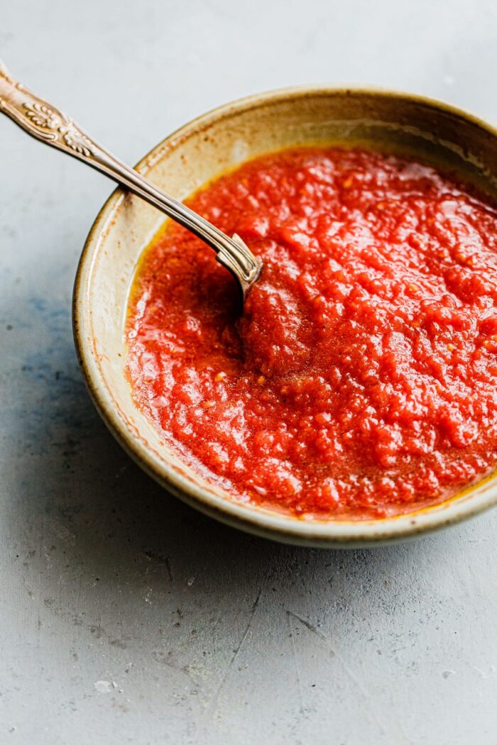 Homemade Pizza Sauce in Bowl with Spoon