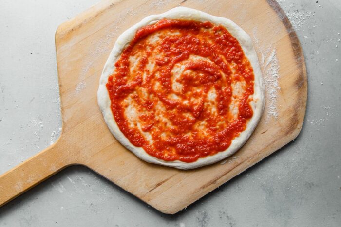 Pizza Sauce Spread on Pizza Dough