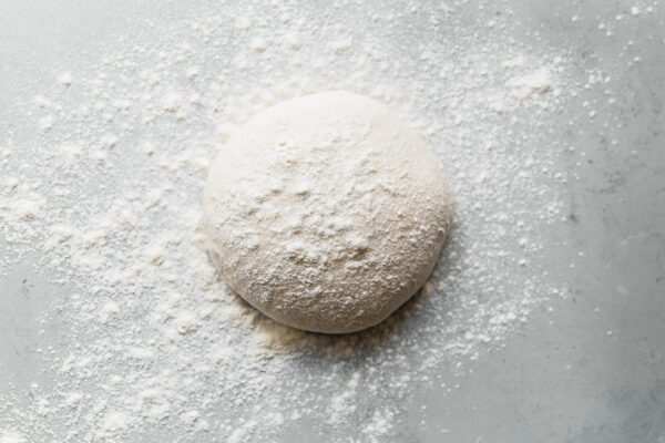 Sourdough Pizza Dough Ball Dusted with Flour