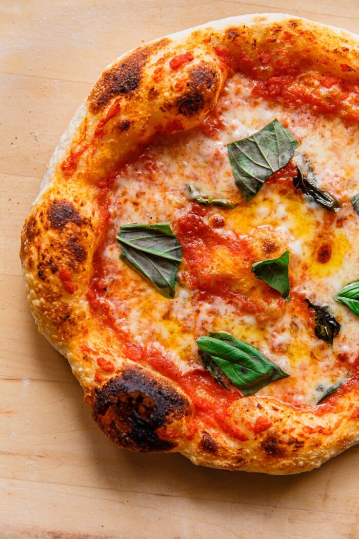 Sourdough Pizza with Mozzarella Tomato and Basil