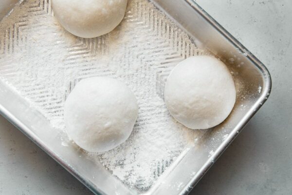 Pizza Dough in Floured Proofing Container