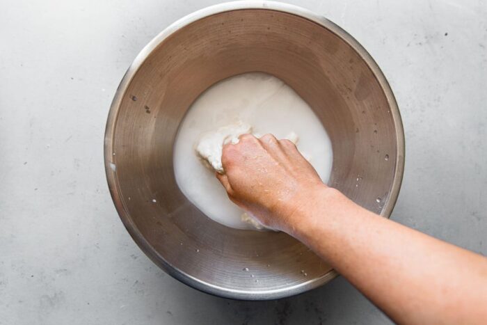 Mixing Sourdough Starter into Water for Pizza Dough