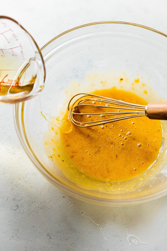 Pouring Oil into Caesar salad Dressing