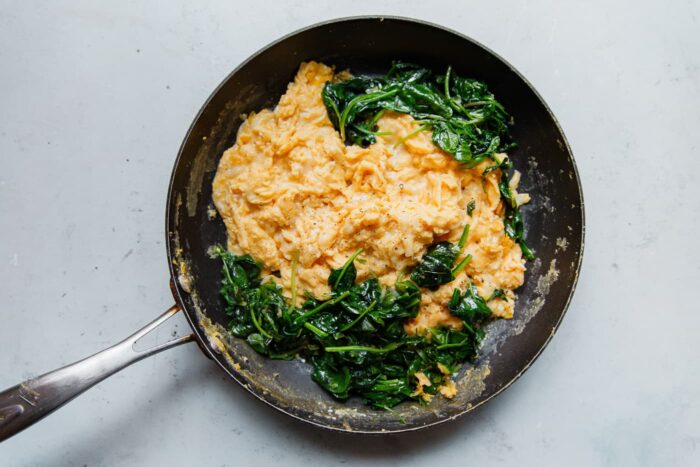 How to Make Cheesy Scrambled Eggs with Greens