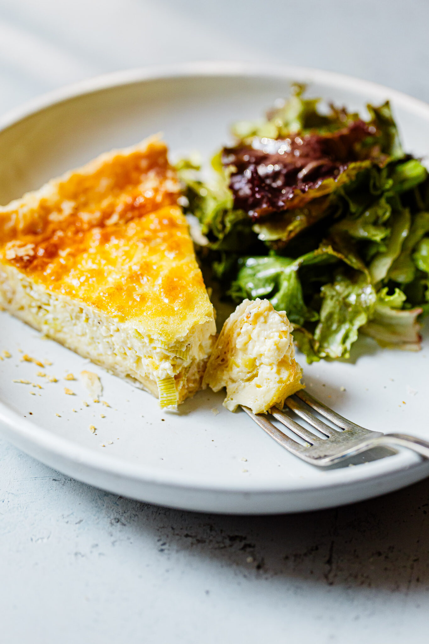 Creamy Leek and Gruyère Tart 2 Delicious Gruyère Leek Quiche on a serving plate